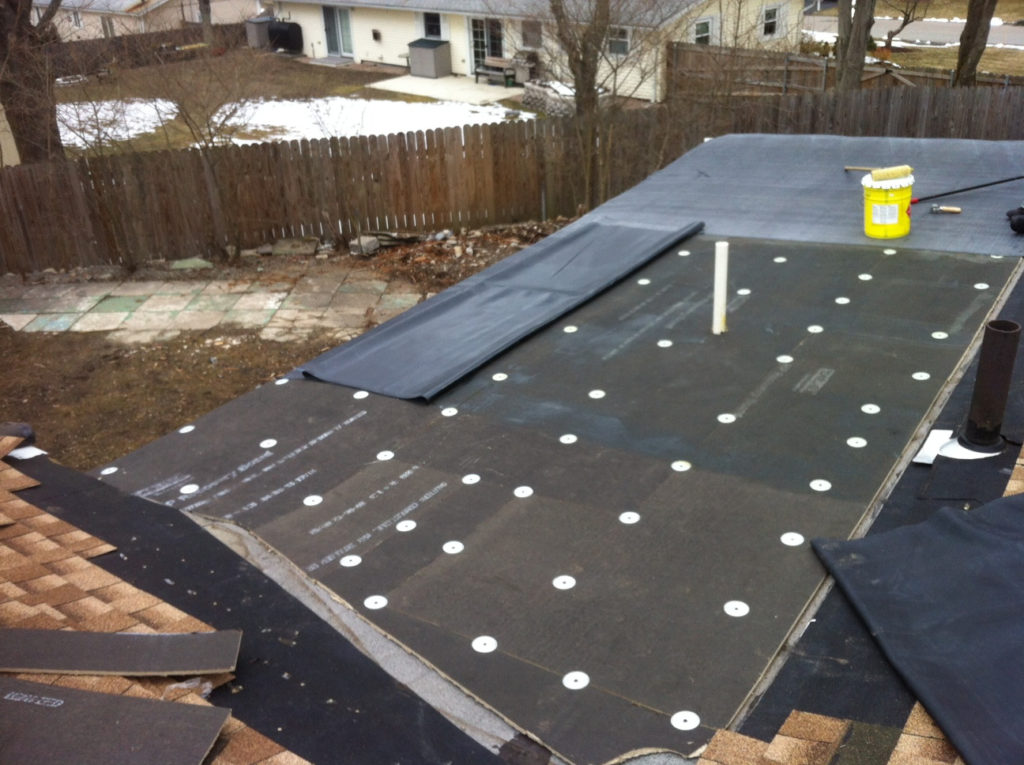 Residential flat roof installation in progress